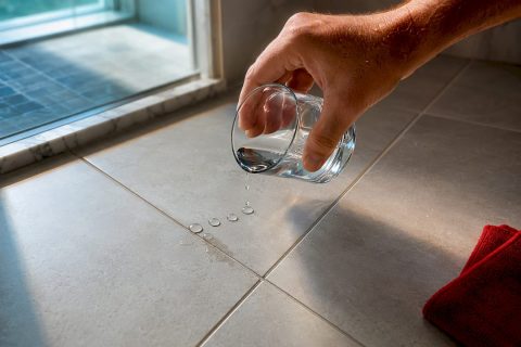 Water droplets testing dry bathroom grout