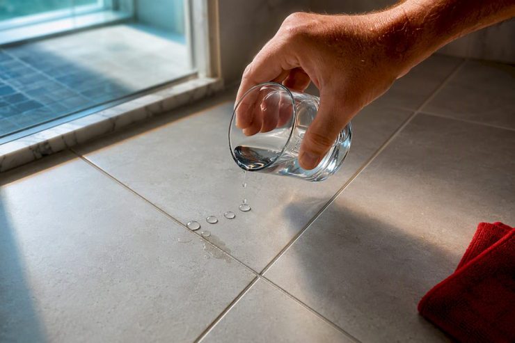 Water droplets testing dry bathroom grout