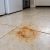 Orange rust stain on pale porcelain tile