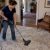 Homeowner vacuuming a thick shag rug